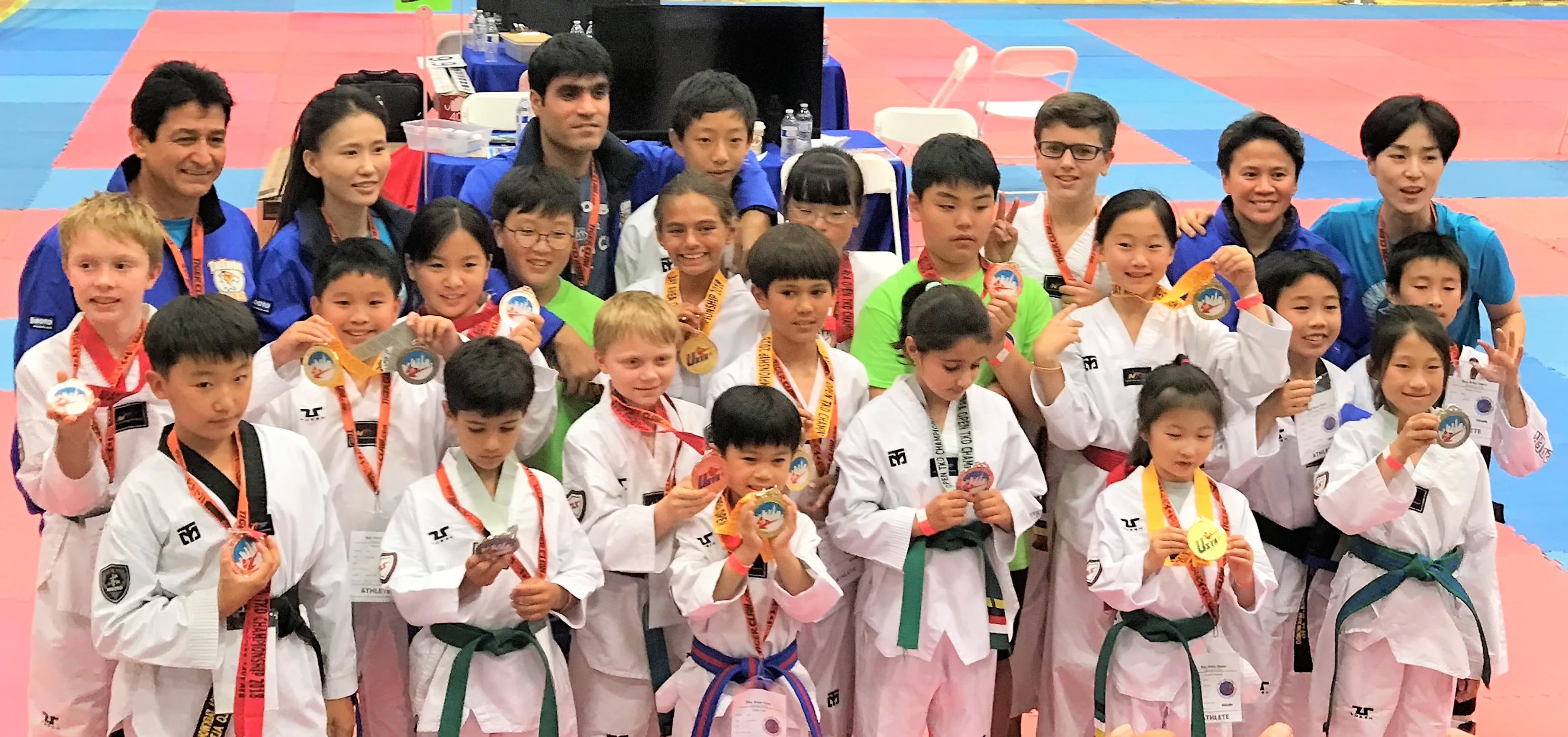 Eagle Taekwondo students with medals at a tournament